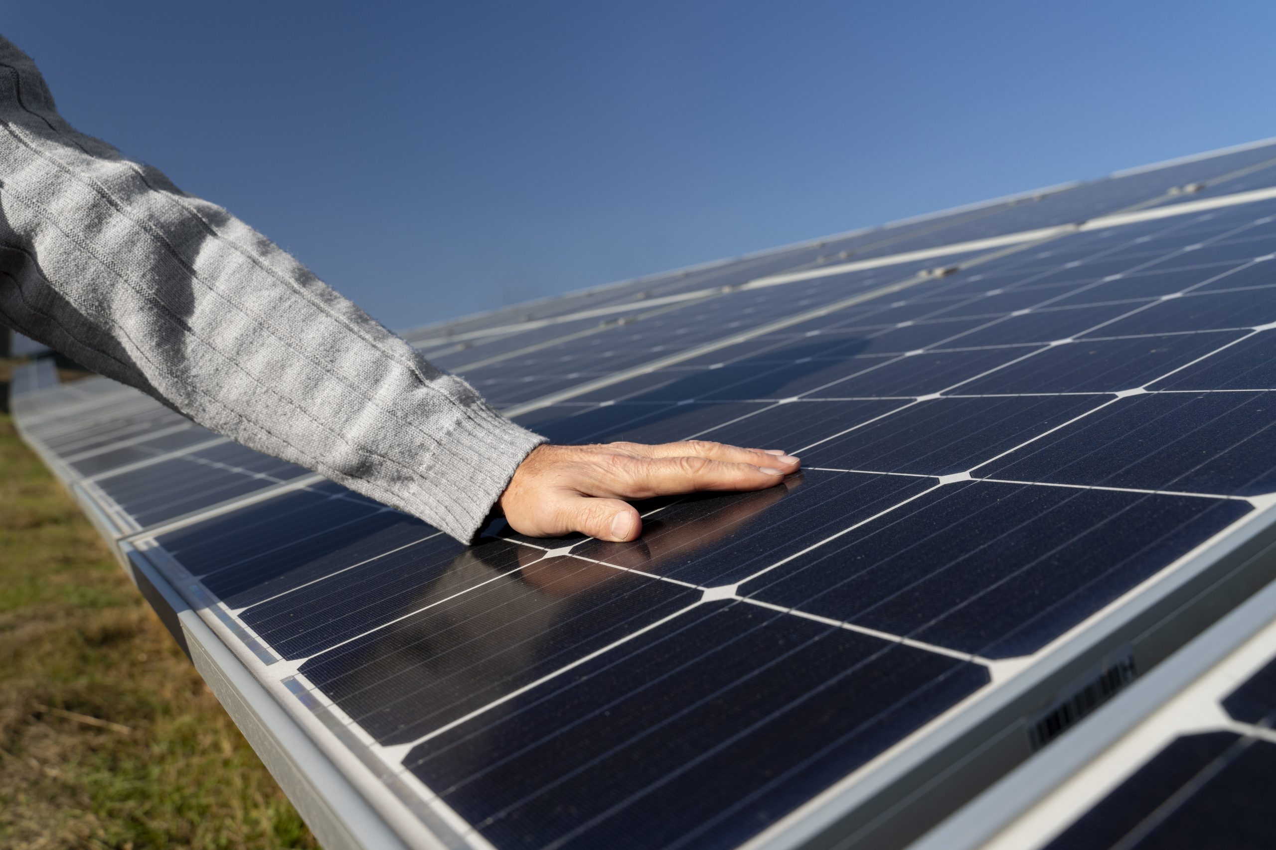About person near alternative energy plant
